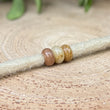 Load image into Gallery viewer, Topaz dreadlock beads on dreadlock