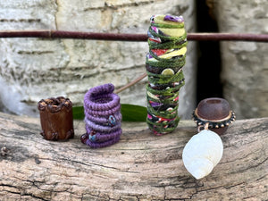 Bead set with leather, glass, fabric and shell