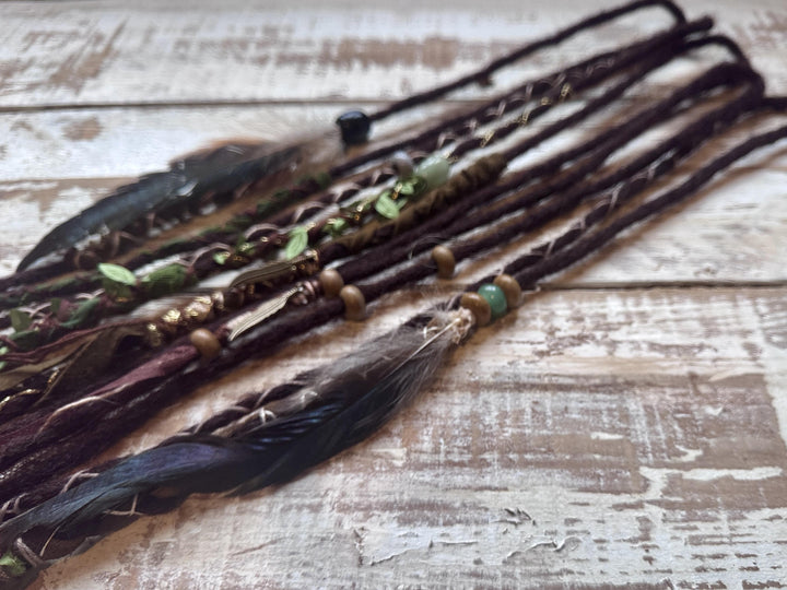 dreadlocks with feather decorations