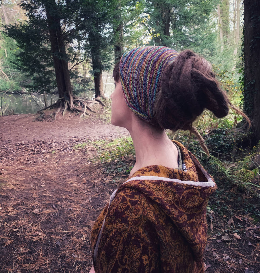 Lady with dreadlocks wearing dread tube