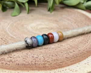 mixed gemstones on dreadlock